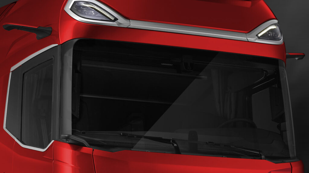 DAF Lkw der neuen Generation mit besonders gewölbten Windschutzscheibe, die das Fahrzeug besonders aerodynamisch macht. Die gewölbte Scheibe senkt den Verbrauch und die Windgeräusche im Fahrerhaus.